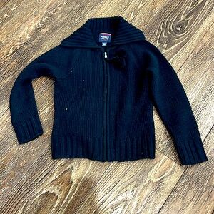 Cowl neck sweater with pom pom zipper